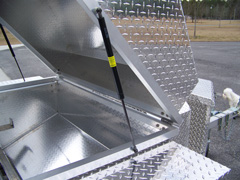 There's a gas assist lift on all our barbecue trailer grills