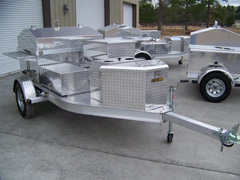 Front view of barbecue grill trailer with storage box