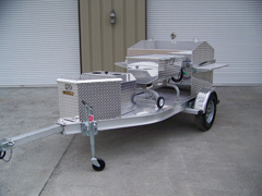 Side view of barbecue grill trailer with storage box